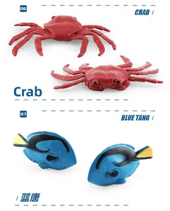 Macro detail of realistic crab and blue tang sea animal model toys with vivid textures