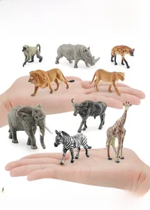 Detailed close-up of realistic African animal figurines held in hand showing actual scale