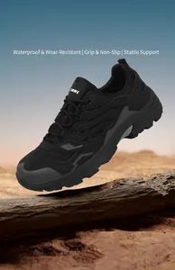 Close-up of hiking shoes on wood featuring breathable mesh and deep-groove rubber soles