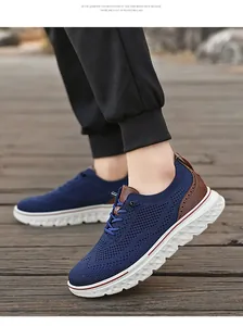 Macro shot of breathable blue mesh knit fabric and brown leather detail on the sneaker