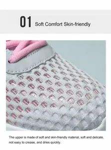 Dettaglio della tomaia in mesh grigio traspirante con lacci rosa su scarpe da corsa donna