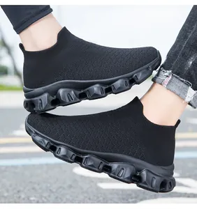 Detailed view of breathable black knit upper and hollow cushioned sole on walking shoes