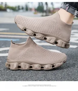 Macro shot of breathable knit upper and cushioned chunky sole on khaki sneakers