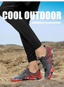 Detailed view of quick-lace system and wave patterns on gray-red water shoes