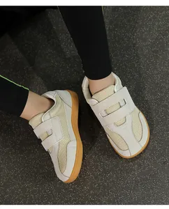Top view of children's mesh retro sneakers featuring double hook-and-loop straps and gum soles