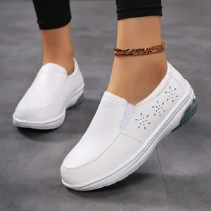 White leather nurse shoes for women with air cushion sole and floral laser-cut details