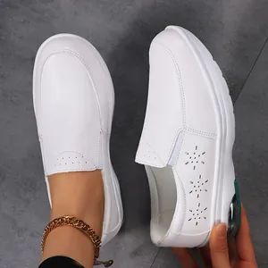 White leather nurses shoes with floral cutouts and air cushion sole for women