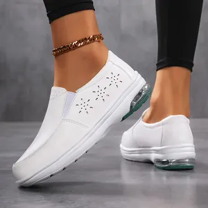 White leather nurse shoes with air cushion sole and flower hollow patterns for women