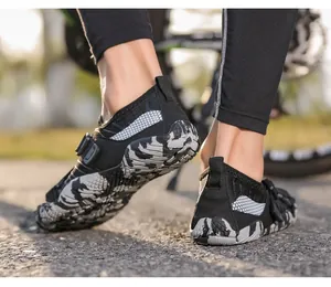Detailed view of durable rubber outsole and camouflage mesh on outdoor wading shoes