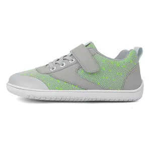 Side view of toddler barefoot shoes featuring breathable neon green mesh and non-slip sole