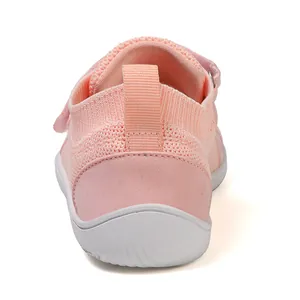 Rear view of pink breathable mesh kids sneakers with heel pull tabs and white rubber soles