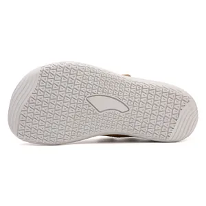Close-up of light grey rubber sole with anti-slip triangle patterns and fish fin decor