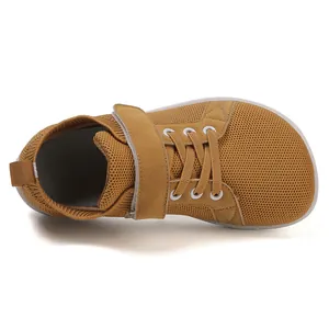 Top view of kids breathable mustard yellow barefoot sneakers with velcro strap and wide toe