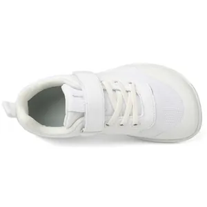 Detail of white wide-toe toddler shoe featuring breathable mesh and secure velcro strap
