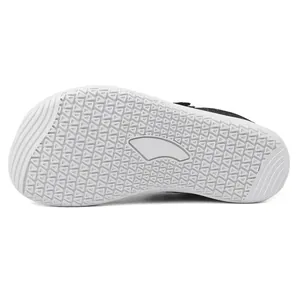 Detailed macro view of non-slip rubber outsole with triangular patterns for kids shoes