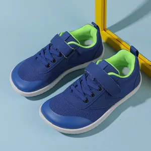 Detailed top view of kids wide-toe sneakers featuring velcro straps and mesh fabric