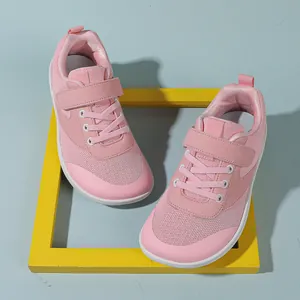 Close-up of pink toddler sneakers showing breathable mesh and velcro strap closure