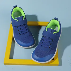 Top view of navy blue kids wide-toe sneakers with breathable mesh and Velcro closure