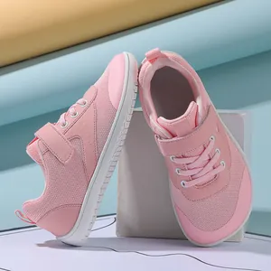 Detail of pink toddler shoes with breathable mesh, velcro straps, and anti-slip rubber soles