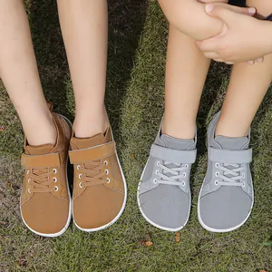 Detail view of children's wide-toe barefoot sneakers with breathable mesh and velcro