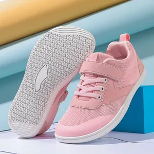 Detailed view of pink toddler shoes featuring anti-slip rubber soles and breathable mesh