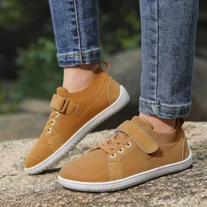 Outdoor shot of kids breathable mesh ginger sneakers with velcro straps and rubber soles