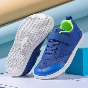 Detail of wide-toe toddler shoes featuring anti-slip rubber soles and mesh fabric