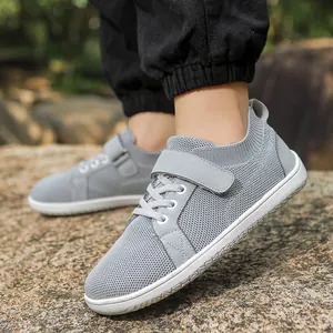 Close-up of kids breathable mesh sneaker with velcro strap on natural outdoor rocks