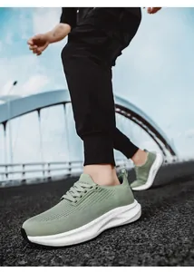 Close-up of grass green breathable mesh sneakers with white thick cushioning soles