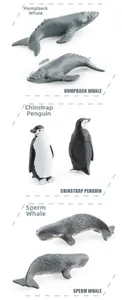 Detailed view of realistic humpback whale, penguin, and sperm whale toy models