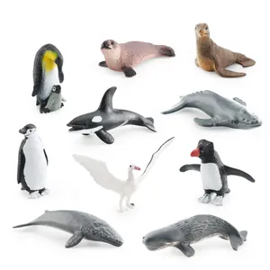 Set of 10 realistic polar animal figurines including penguins, whales and seals on white background