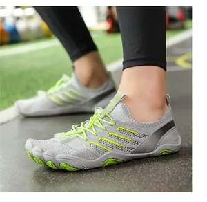 Detail of grey and green quick-dry water shoes with elastic speed laces and grip sole