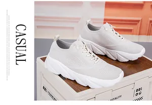 Detailed close-up of breathable knit mesh and chunky sole on off-white running shoes