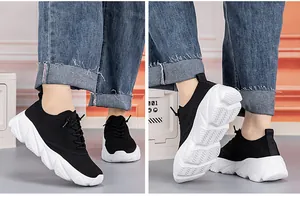Detail of black breathable mesh running shoes with thick white wavy cushioned outsoles