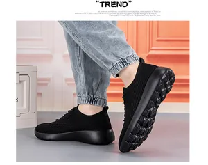 Detail of black breathable knitted sock shoes with textured anti-slip cushioned soles