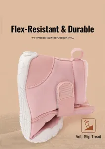 Flexible white rubber sole of pink kids snow boots showing non-slip texture and flexibility