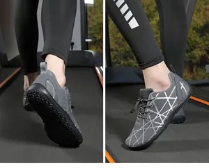 Detail of dark grey barefoot sneakers with mesh fabric and anti-slip rubber sole