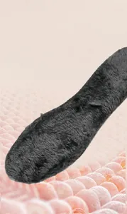 Detail view of removable grey plush lining and thick insulated insole for winter shoes