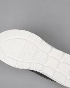 Detail shot of the white MD sole featuring anti-slip texture for enhanced grip and comfort