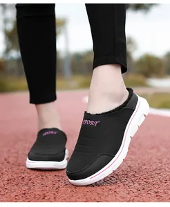 Close-up of winter warm slip-on shoes featuring thick fleece lining and durable sport soles