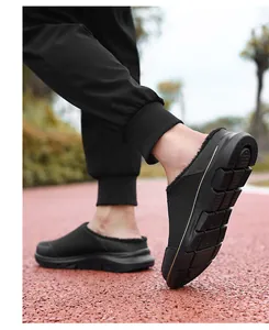 Macro view of thick anti-slip sole and warm fleece lining on black winter slip-on shoes