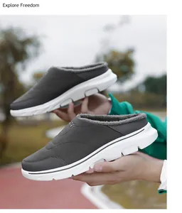 Detail showing the thick faux fur lining and quilted upper of dark grey thermal shoes
