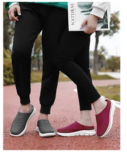 Close-up of waterproof thermal mules with thick fleece lining and non-slip sport soles