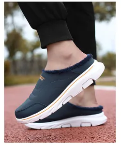 Detail view of navy blue winter slipper with warm fleece lining and sport embroidery