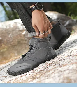 Detailed view of dark grey waterproof outdoor boots with warm fleece lining and toggle
