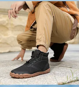 Close-up of waterproof outdoor winter boots with fleece lining and drawstring system
