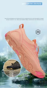 Detail showing the drainage holes and non-slip rubber sole of the pink wading shoes