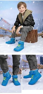 Close-up of blue kids winter snow boots with warm faux fur lining and anti-slip sole