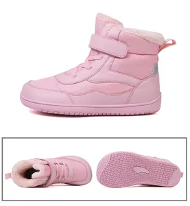 Detail of pink winter boots showing warm plush lining and non-slip rubber outsole texture