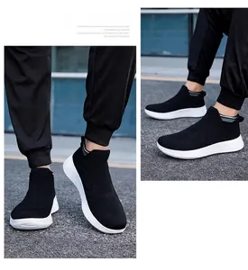 Detailed close-up of black breathable knit mesh texture on slip-on athletic sock sneakers